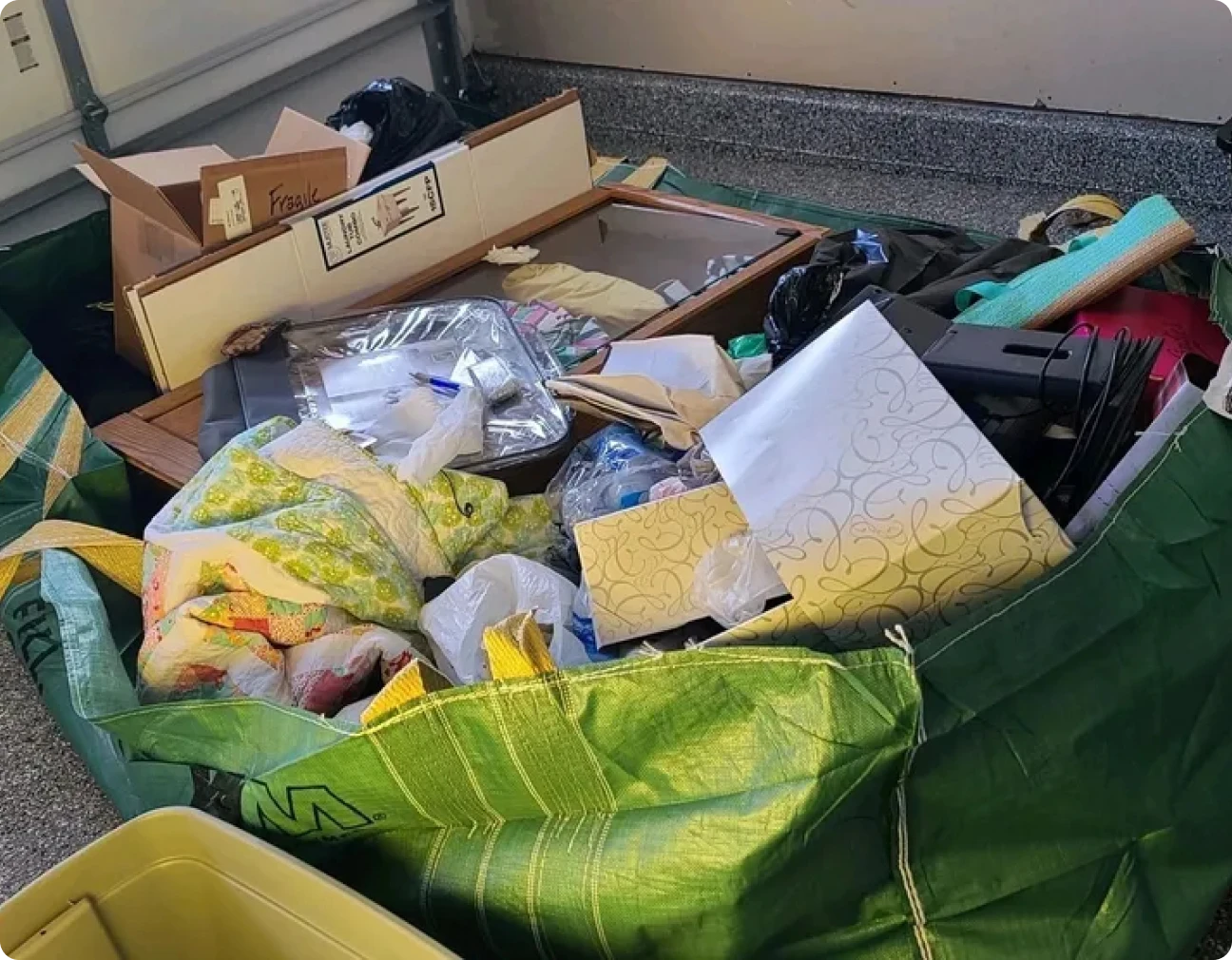 Assorted items in green bags